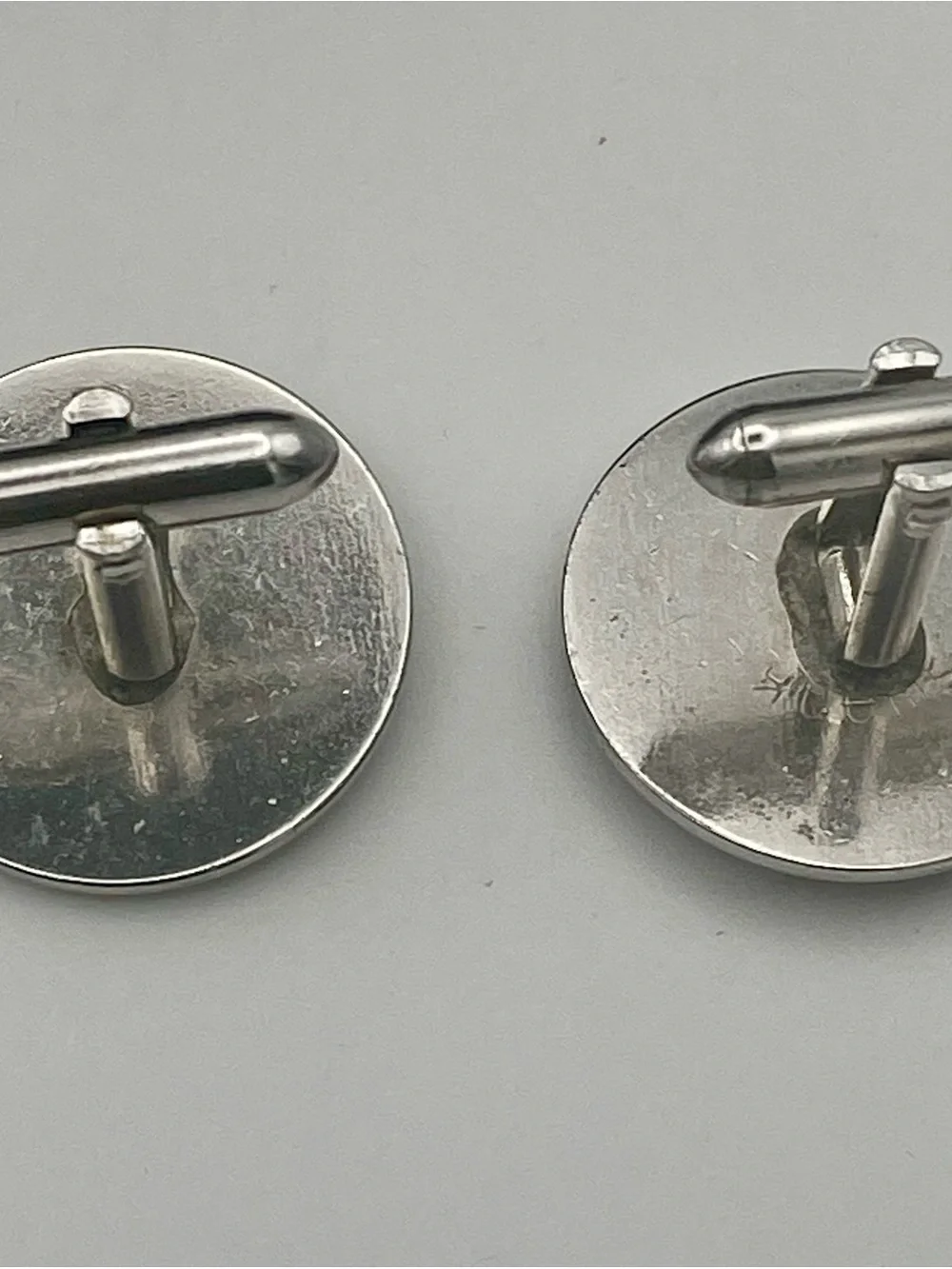Silver Round Cufflinks with Triangle Emblem Inlaid with Crystal Detail